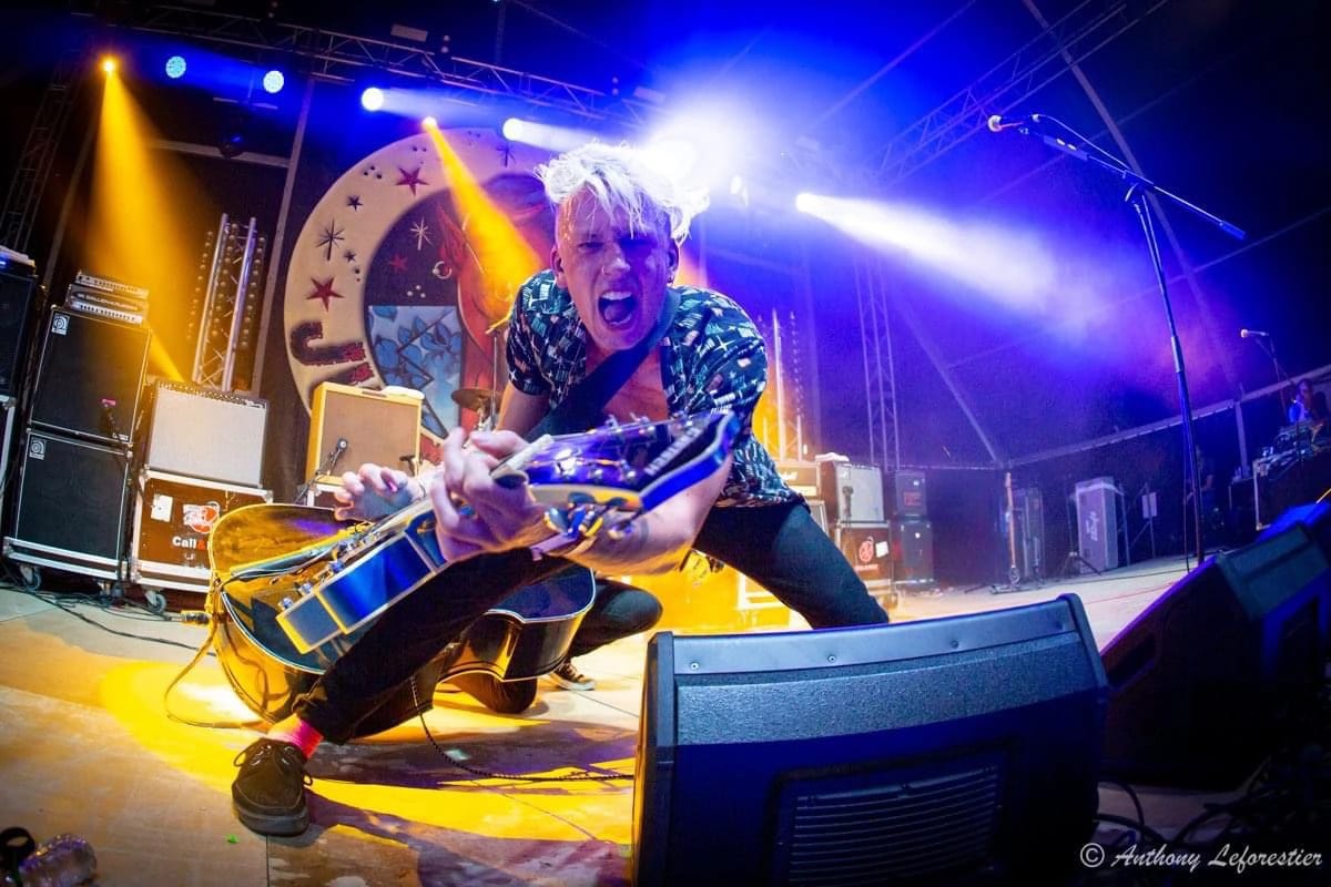 Ricky Delaney on stage at Pineda Festival in Spain performing to the camera